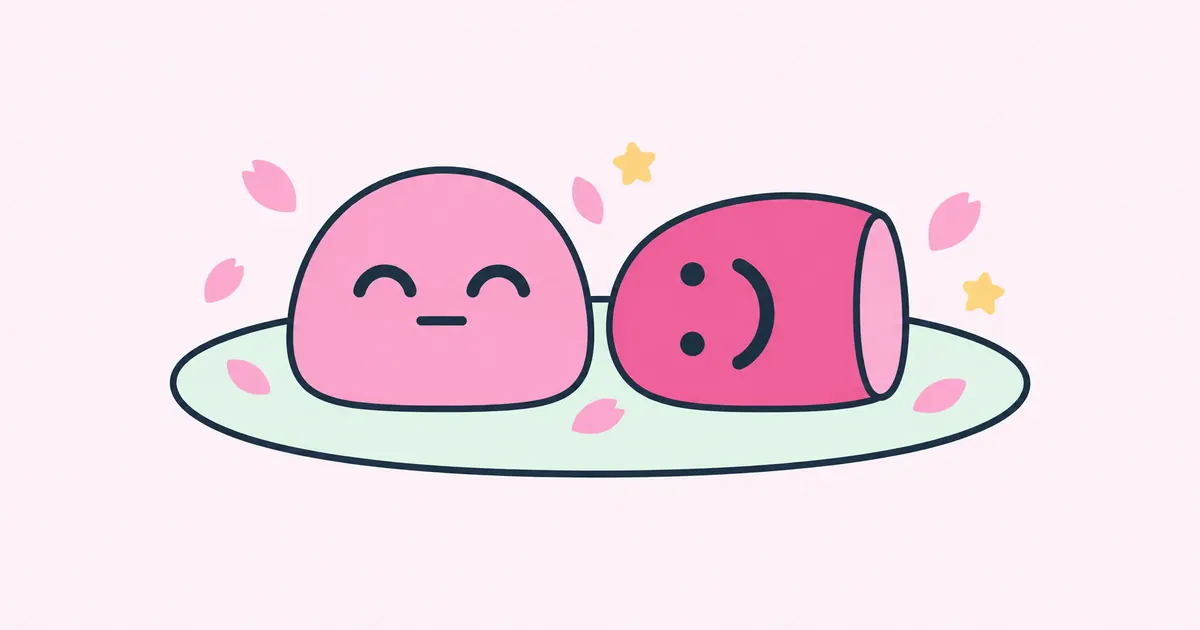 Two pink mochi on a plate: one sits upright with curved, smiling eyes and a flat mouth, the other lies on its side with dot eyes and a big smile.